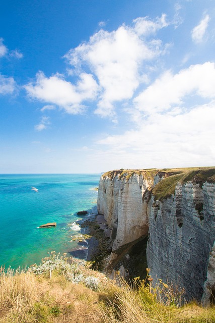 Stunning blue waters and white cliffs of a Mediterranean coast, perfect for Wander Vista coastal adventures.